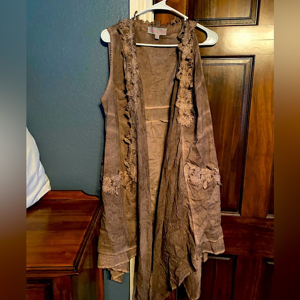 Taupe or dark brown sleeveless long flowing vest. Great for layering.